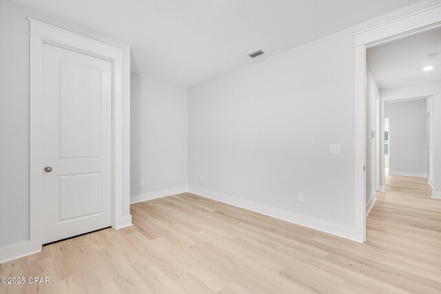 spare room with light wood-type flooring