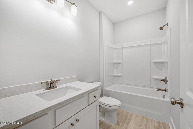 full bathroom with vanity, shower / bathing tub combination, and toilet