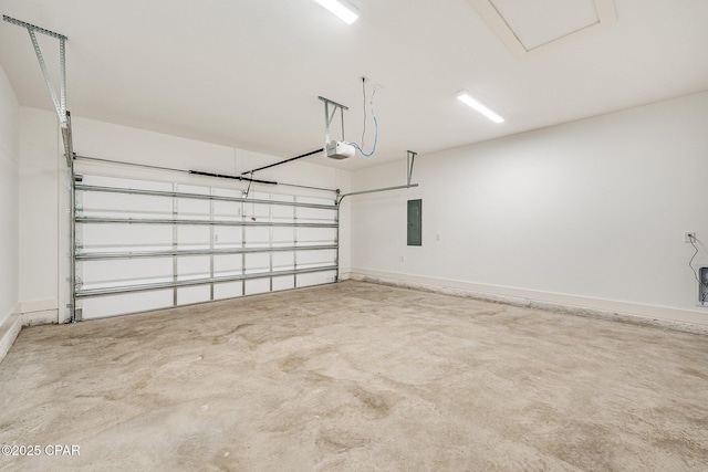 garage with a garage door opener and electric panel