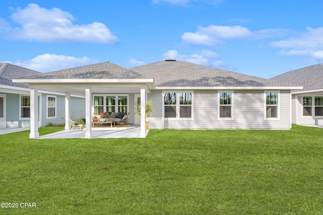 rear view of house featuring an outdoor living space, a patio, and a yard