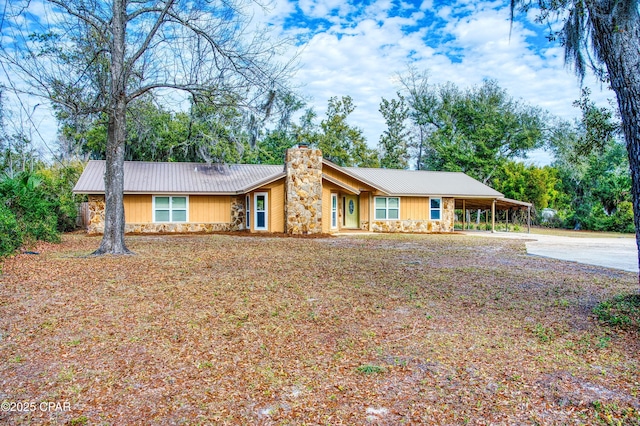 ranch-style home with a carport