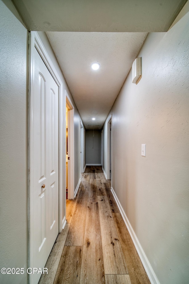 hallway featuring light wood-type flooring