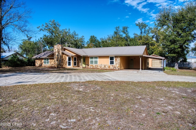 ranch-style home featuring a carport