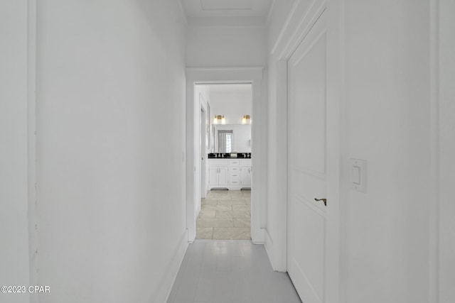 hall featuring light tile patterned floors