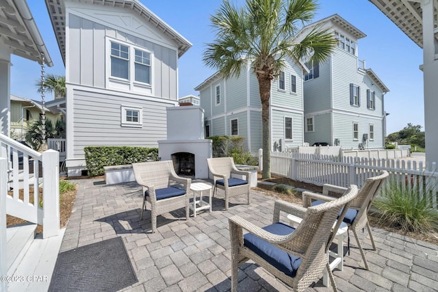 view of patio / terrace with an outdoor fireplace