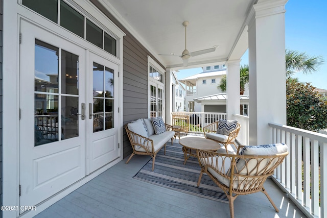 balcony with ceiling fan and french doors