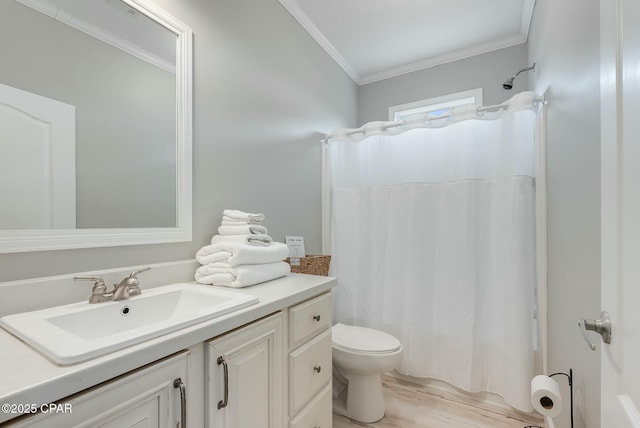 bathroom with hardwood / wood-style floors, toilet, crown molding, vanity, and lofted ceiling