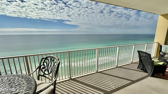 balcony featuring a water view