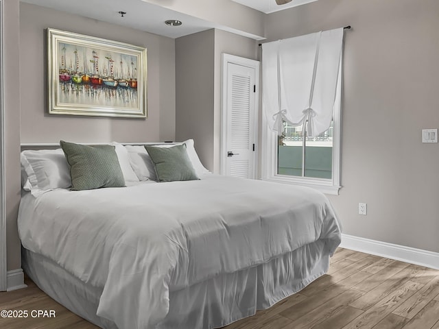 bedroom with wood-type flooring