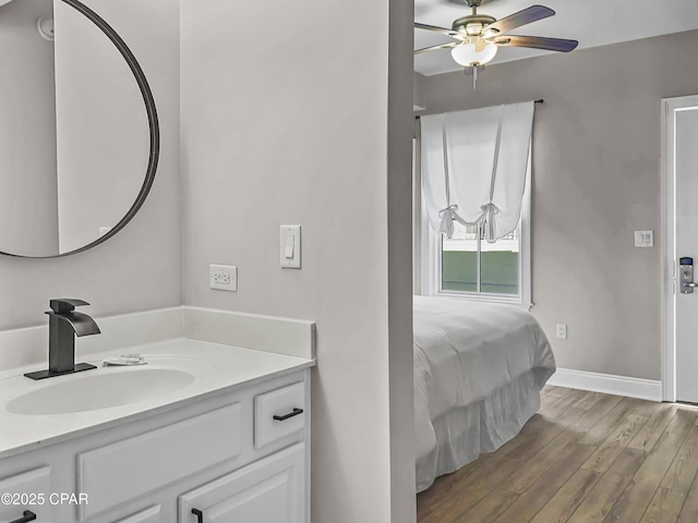 bathroom featuring vanity, wood-type flooring, and ceiling fan