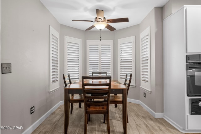 dining room featuring ceiling fan and light hardwood / wood-style floors