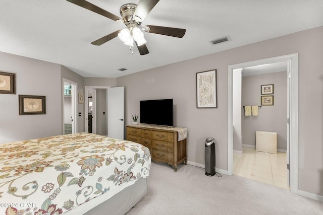 carpeted bedroom featuring ceiling fan and connected bathroom