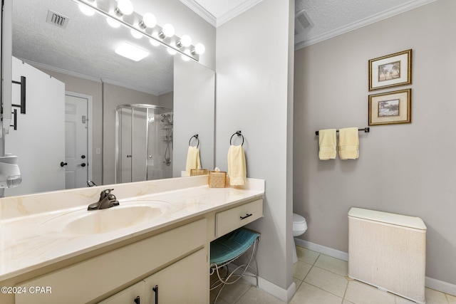 bathroom with a textured ceiling, tile patterned flooring, a shower with shower door, vanity, and crown molding