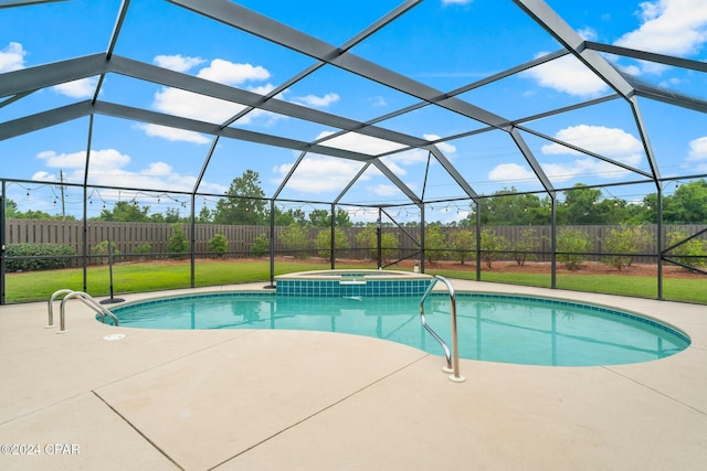 view of pool with a yard, a lanai, an in ground hot tub, and a patio