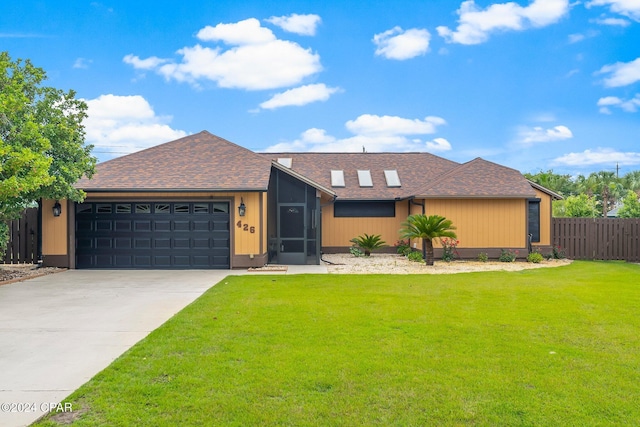 ranch-style house with a garage and a front yard