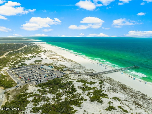 birds eye view of property featuring a beach view and a water view