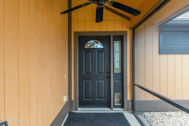 entrance to property featuring ceiling fan