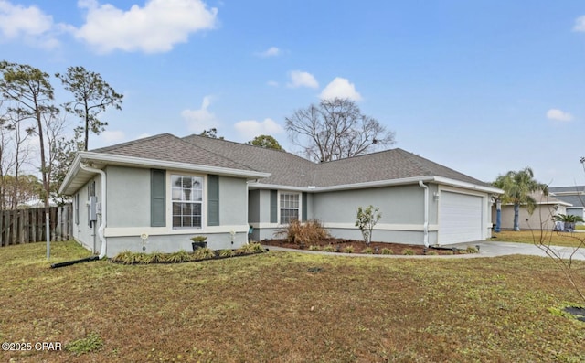 ranch-style home with a garage and a front lawn