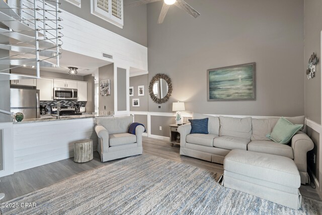 bedroom with wood-type flooring and ceiling fan