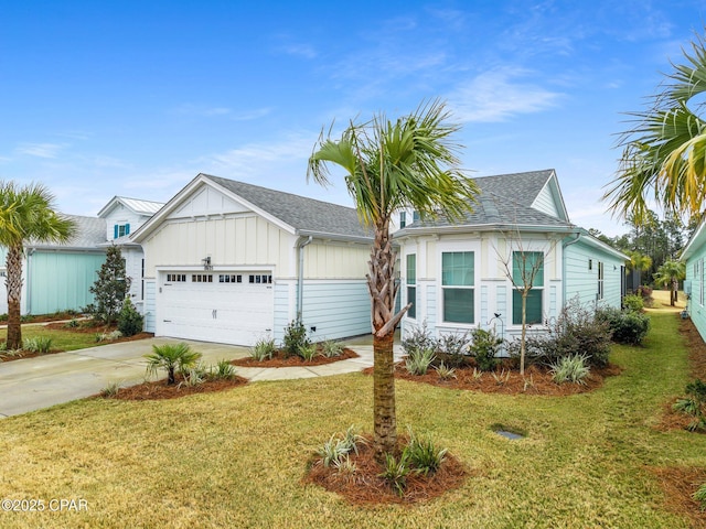 view of front of property featuring a garage and a front lawn