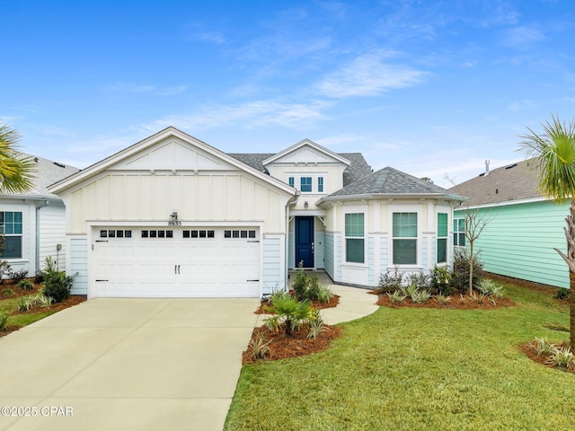 view of front of home featuring a front lawn, a garage, board and batten siding, and driveway