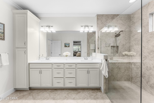 full bath with double vanity, ornamental molding, a walk in shower, and a sink