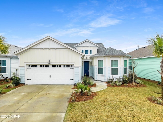 view of front of house featuring a garage and a front lawn