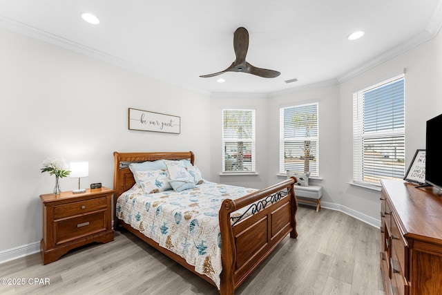 bedroom featuring ornamental molding, ceiling fan, light hardwood / wood-style floors, and multiple windows