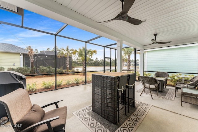 sunroom / solarium with ceiling fan