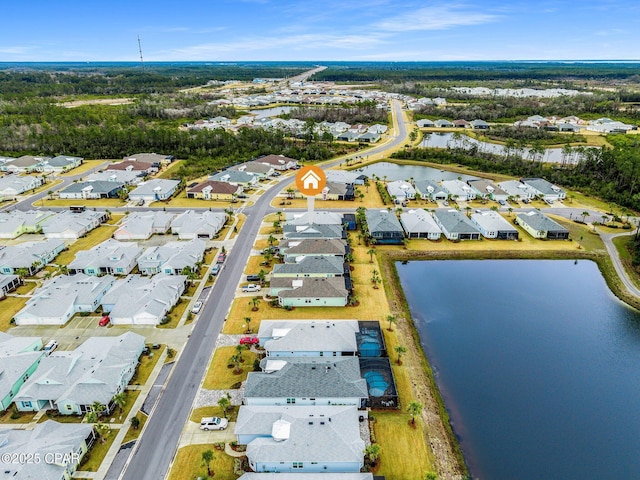 birds eye view of property with a water view and a residential view