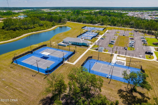 birds eye view of property with a water view