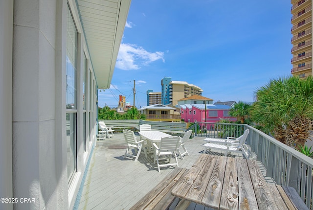 deck with outdoor dining area