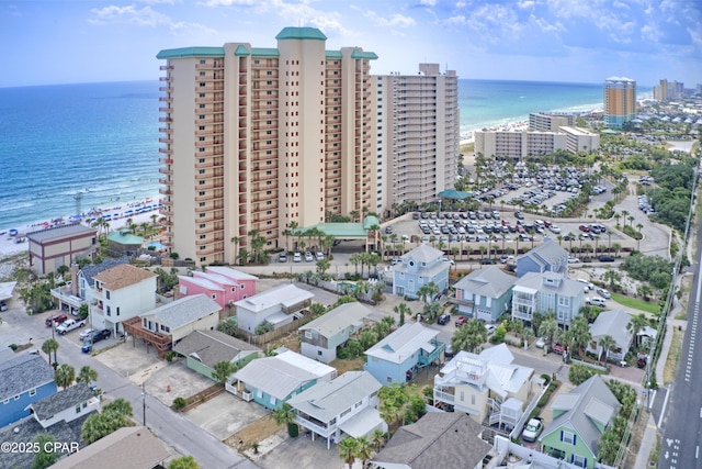 birds eye view of property featuring a view of city and a water view