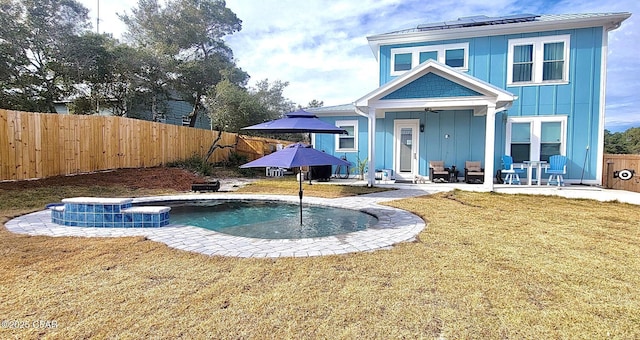 view of pool featuring a yard and a patio area