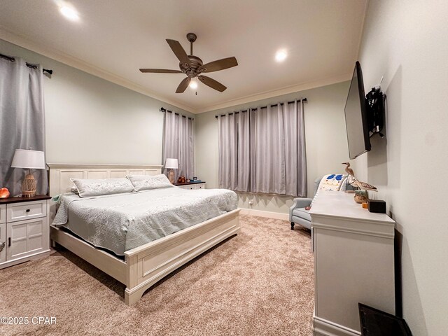 bedroom with crown molding, light colored carpet, and ceiling fan