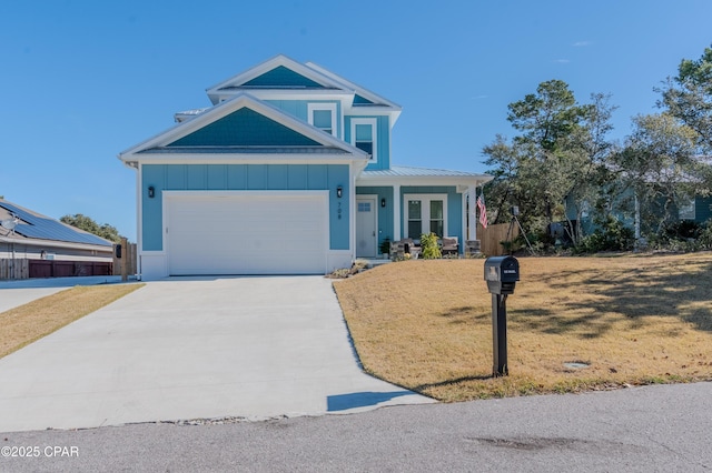 view of front of home featuring a front yard and french doors