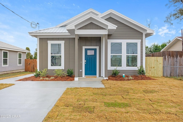 bungalow with a front lawn