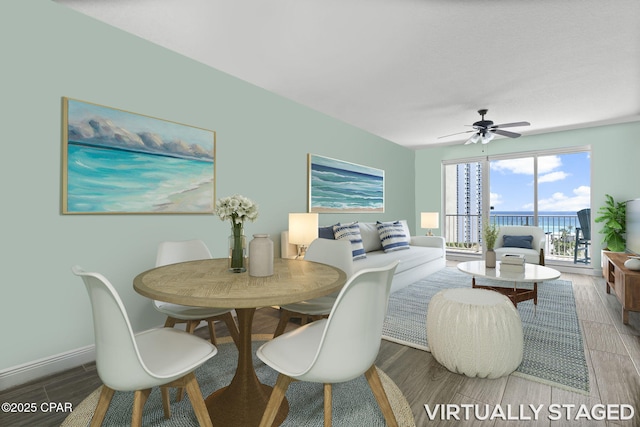 dining space featuring ceiling fan and hardwood / wood-style floors