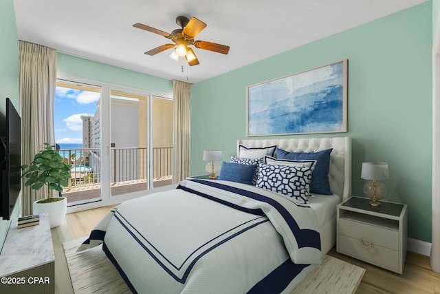 bedroom with ceiling fan, access to exterior, and light hardwood / wood-style flooring