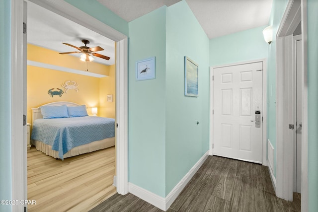 bedroom featuring ceiling fan and wood-type flooring