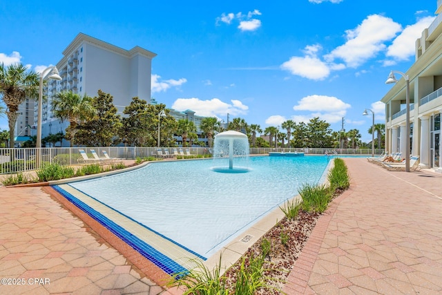 view of swimming pool with pool water feature