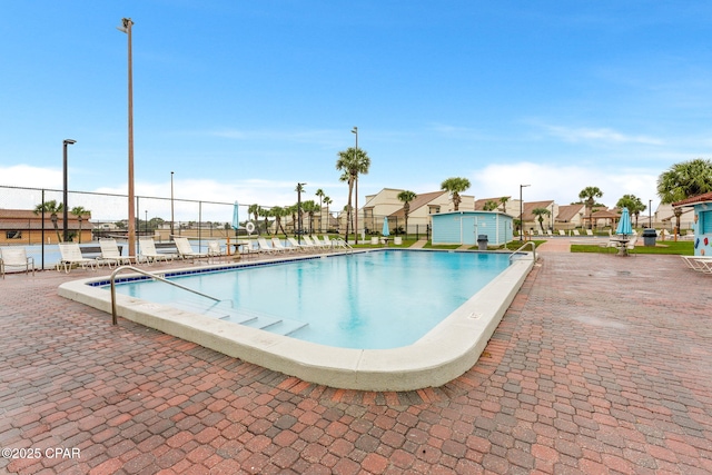 view of swimming pool with a patio