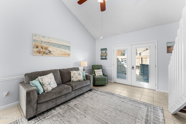 living room with ceiling fan, light tile patterned floors, high vaulted ceiling, and french doors