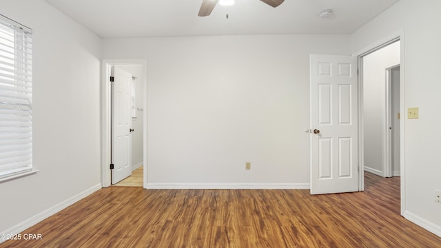 unfurnished room featuring hardwood / wood-style flooring and ceiling fan