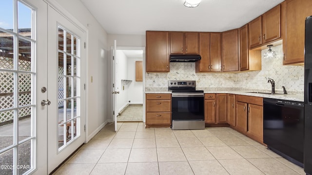 kitchen with stainless steel electric range oven, black dishwasher, sink, decorative backsplash, and light tile patterned floors