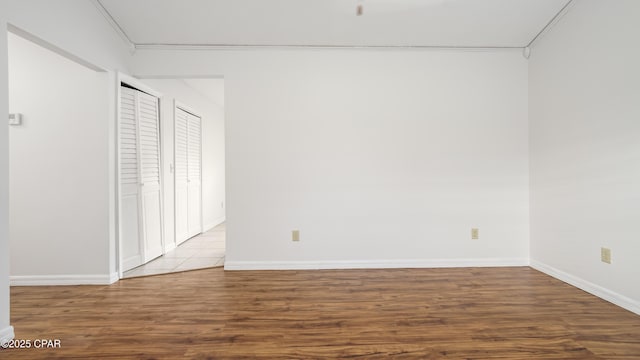 unfurnished bedroom featuring light wood-type flooring