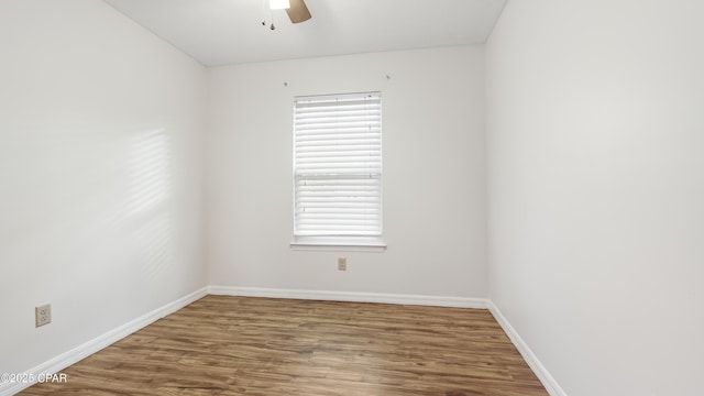 unfurnished room with wood-type flooring and ceiling fan