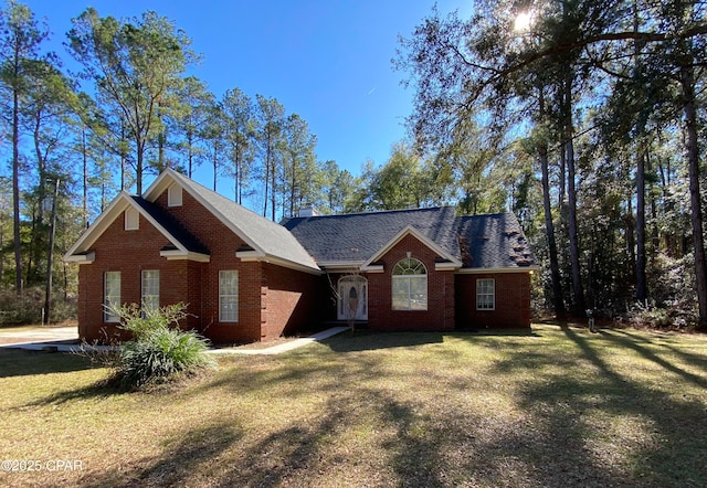 single story home featuring a front yard