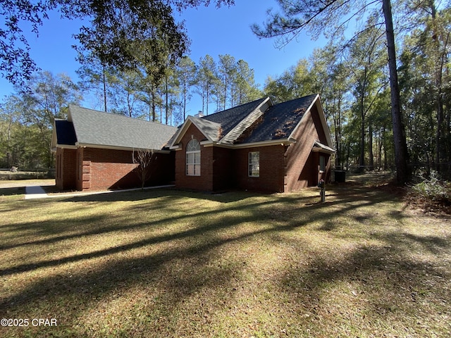 view of home's exterior with a yard