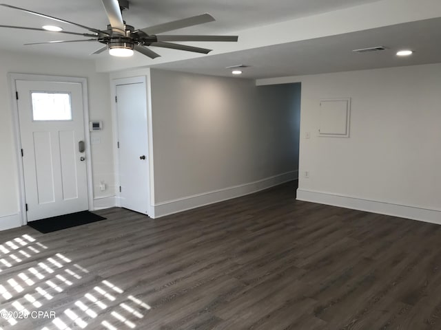 foyer entrance featuring dark wood-type flooring and ceiling fan